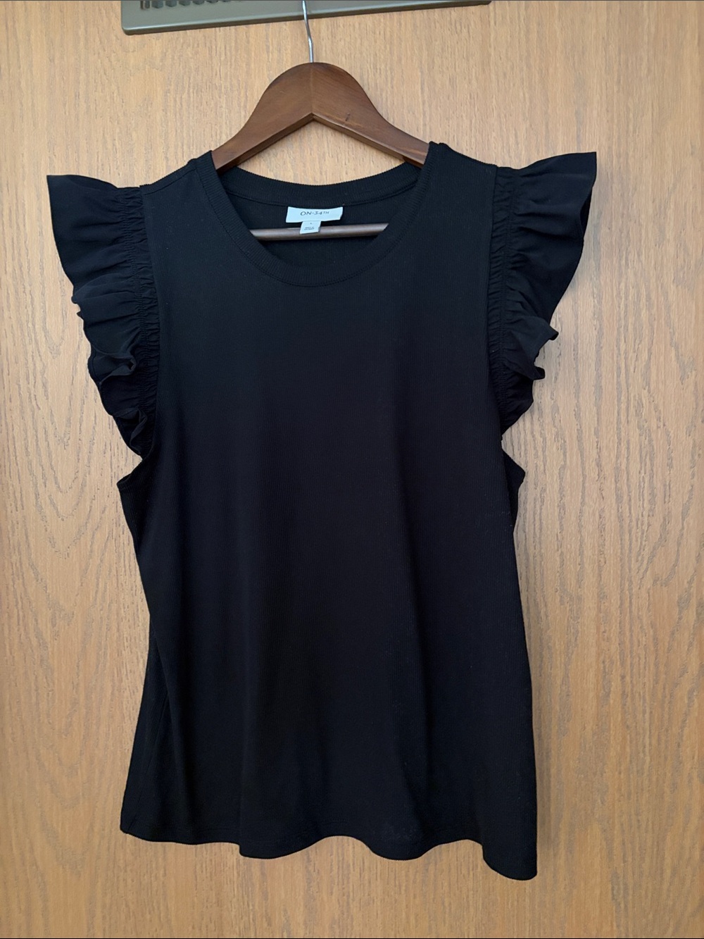 On 34th street Black Ruffle-Sleeve Knit Tank